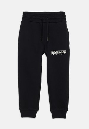 Joggers de algodón negros con una cintura elástica, cordón y puños acanalados. Presenta texto de logo blanco en el muslo izquierdo.