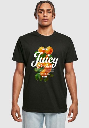 Black cotton t-shirt featuring a colorful "Juicy Peaches" print with orange peaches and green leaves. Short sleeves and round neck design.