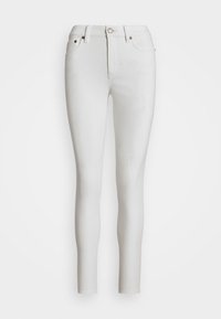 Jeans skinnys blancos de denim, con una cintura alta, cinco bolsillos y detalles en metal dorado.