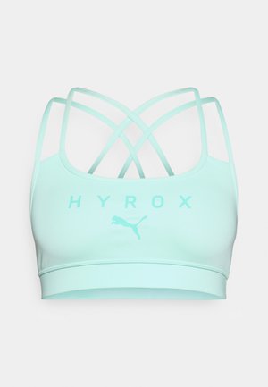 Reggiseno sportivo verde menta chiaro con un tessuto liscio, caratterizzato da un logo e il testo "HYROX" sul fronte, e spalline incrociate sul retro.