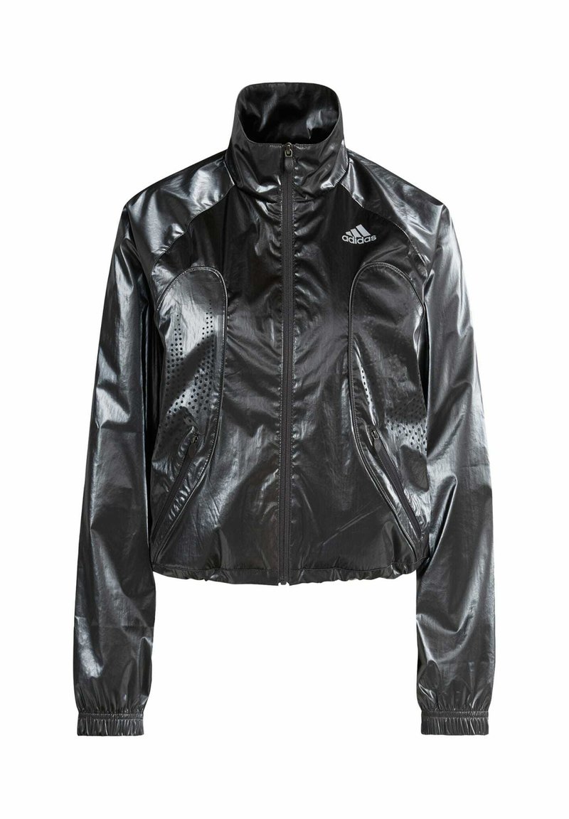 Black, glossy, cropped jacket with a high collar, zip closure, side pockets, and perforated detailing. Features adidas logo on the chest.