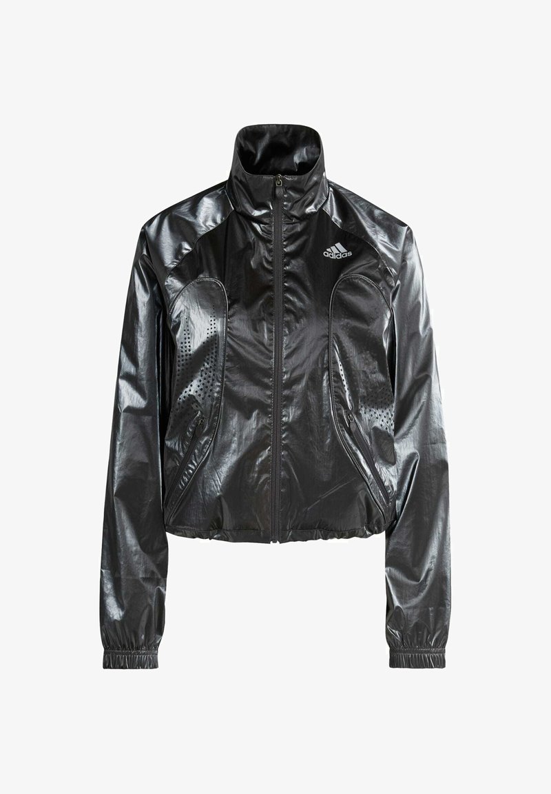 Black, glossy, cropped jacket with a high collar, zip closure, side pockets, and perforated detailing. Features adidas logo on the chest.