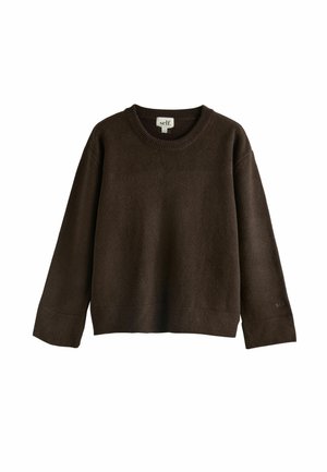 Ruskea, pitkähihaisuus neule pehmeästä kankaasta. Pyöreä pääntie ja rento malli, jossa resorit hihansuissa. Minimalistinen brändäys hihassa.