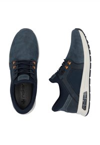 Navy blue sneakers with suede and mesh materials, featuring orange accents, lace-up design, and a visible air cushioning unit on the sole.