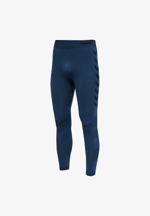 Collants de sport navy avec une texture lisse, dotés d'une taille haute, d'accents au niveau des genoux et de motifs en chevrons noirs sur les côtés.