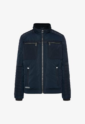 Navy padded jacket featuring a zip front, high collar, two chest pockets with zippers, and textured accents on the shoulders and sleeves.