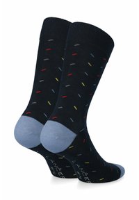 Granatowe skarpetki w wielokolorowe kropki. Posiadają jasnoniebieski akcent wokół pięty i palców, wykonane z gładkiego dzianiny.