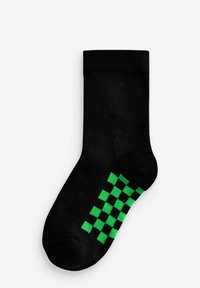 Calzino in cotone nero con un motivo a scacchi verde nella zona della caviglia. Design a maglia texturizzata con un polsino a costine.