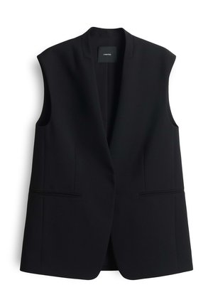 Black sleeveless blazer in a structured design, featuring a shawl collar and two front pockets with a smooth texture.