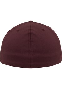 Maroon baseball cap with a rounded crown, made of textured fabric. Features six ventilation holes and a top button, smooth finish.