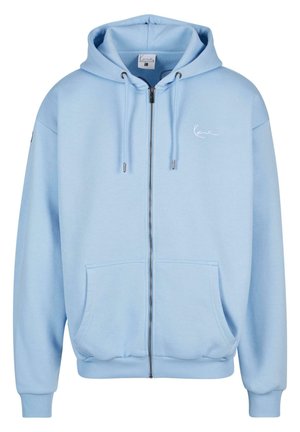 Light blue zip-up hoodie made of soft fabric. Features a hood, front pockets, ribbed cuffs, and hem. Subtle logo detail on the chest.