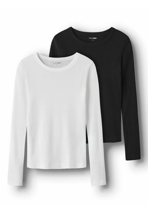 Dve majici z dolgimi rokavi v beli in črni barvi, izdelani iz žamete tkanine. Obe imata okrogel izrez in ravne robove, brez dodatne opreme.