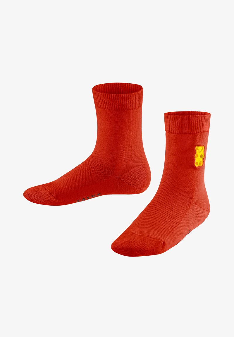 Rote Knöchelstrümpfe aus weichem Stoff, mit einem gerippten Bündchen, glatter Textur und einem gelben Gummibären-Emblem an der Seite.