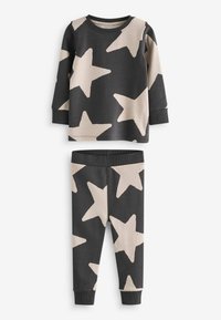 Haut à manches longues gris foncé et pantalon assorti avec grands motifs d'étoiles beiges, poignets et ceinture côtelés, posés à plat sur fond blanc.