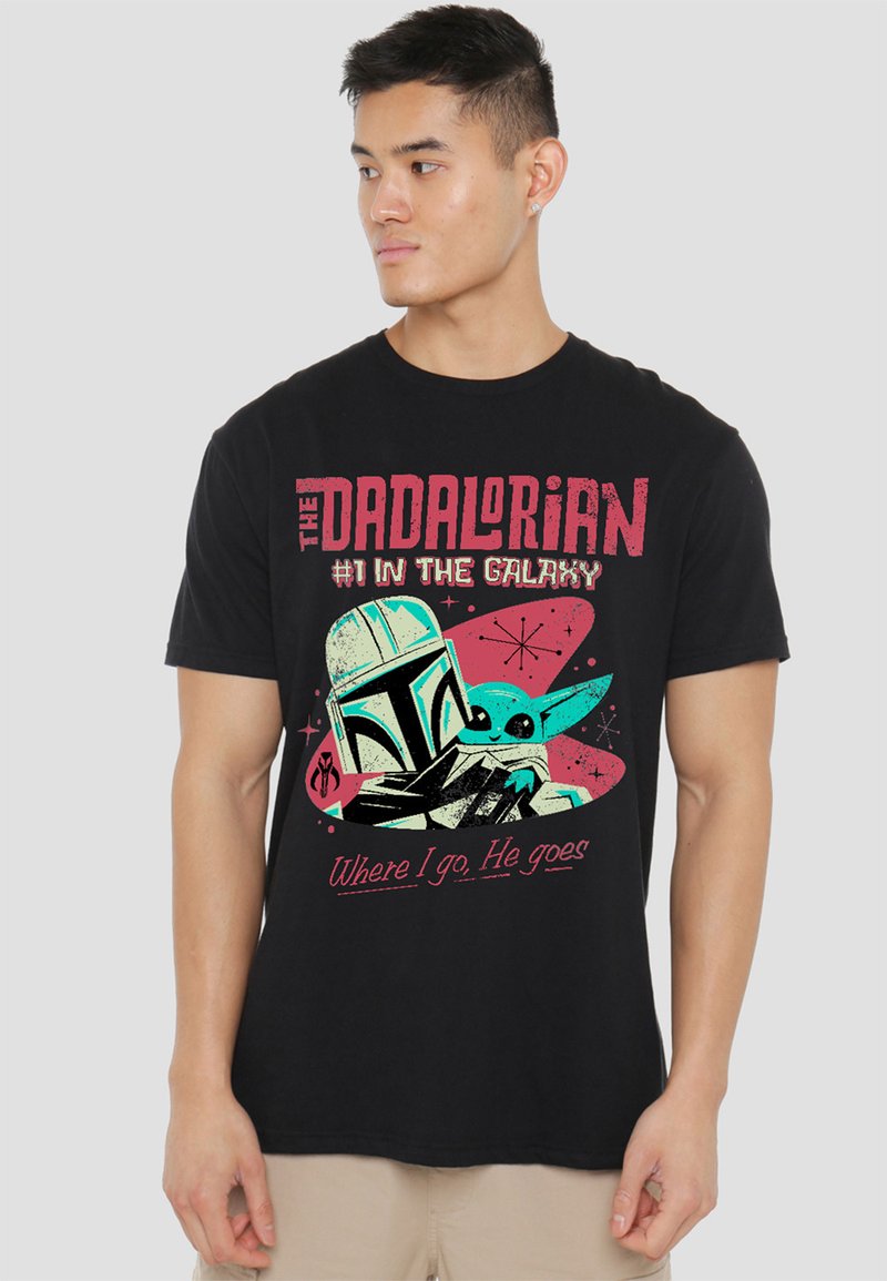 Black short-sleeve T-shirt featuring a graphic design of a helmeted character and a small figure with the text "THE DADALORIAN #1 IN THE GALAXY."