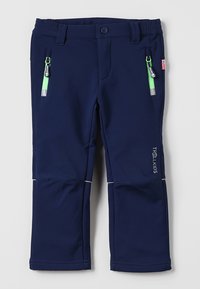 Navy blue softshell pants with elastic waistband, two front zip pockets featuring green hardware, and reflective accents on the seams.