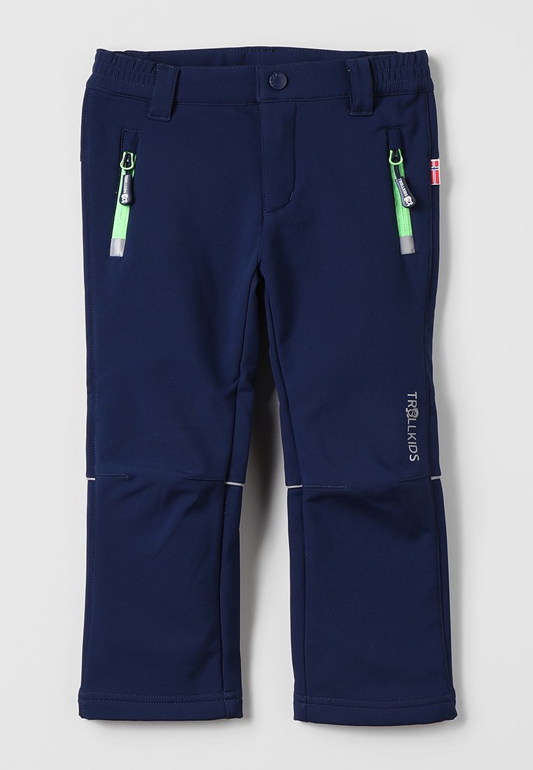 Navy blue softshell pants with elastic waistband, two front zip pockets featuring green hardware, and reflective accents on the seams.