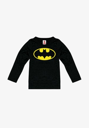 Black long-sleeve t-shirt made of soft fabric featuring a large, distressed yellow Batman logo on the front. Tag visible at the neck.