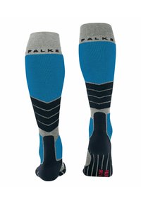 Knielange sokken met een grijze bovenkant, blauwe schacht en zwarte accenten met een geometrisch ontwerp en ribbeltextuur; gemerkt "FALKE" op de rand.
