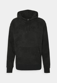 Black hooded sweatshirt made of soft fabric. Features a kangaroo pocket and embossed "Nike SB" logo on the front. Classic fit and ribbed cuffs.