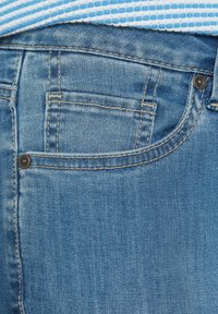 Blue denim jeans with a classic design. Features include a small back pocket, visible stitching, and a smooth texture.