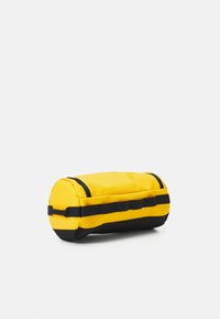 The North Face TRAVEL CANISTER - Mosózsák - summit gold/black