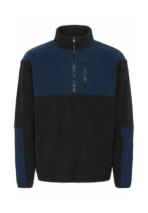 Pull en polaire noir et bleu marine avec une fermeture à demi-zip, deux poches latérales et une poche poitrine zippée. Texture lisse.