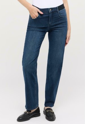 Dark blue denim jeans with a straight leg design, front pockets, and a black waistband. Worn with black loafers.