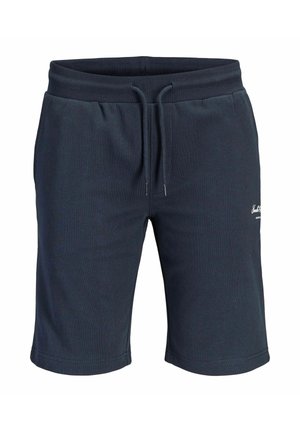 Pantalones cortos azul marino con cordón y cintura elástica, con un pequeño logo blanco en el muslo derecho, hechos de tela suave.