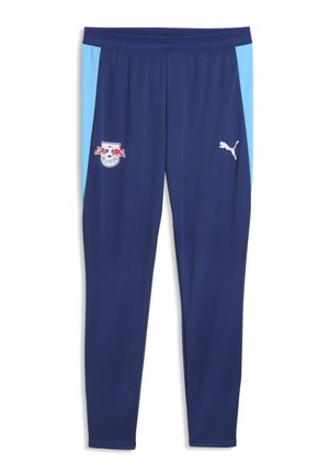 Pantalon de sport bleu marine avec des panneaux latéraux bleu clair, logo RB Leipzig sur la cuisse gauche et logo Puma blanc sur la cuisse droite.