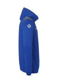 Blå hættejakke lavet af glat stof, med en sidelukning, ribbede manchetter og et prikket mønster ved skuldrene. Logo på ærmet.