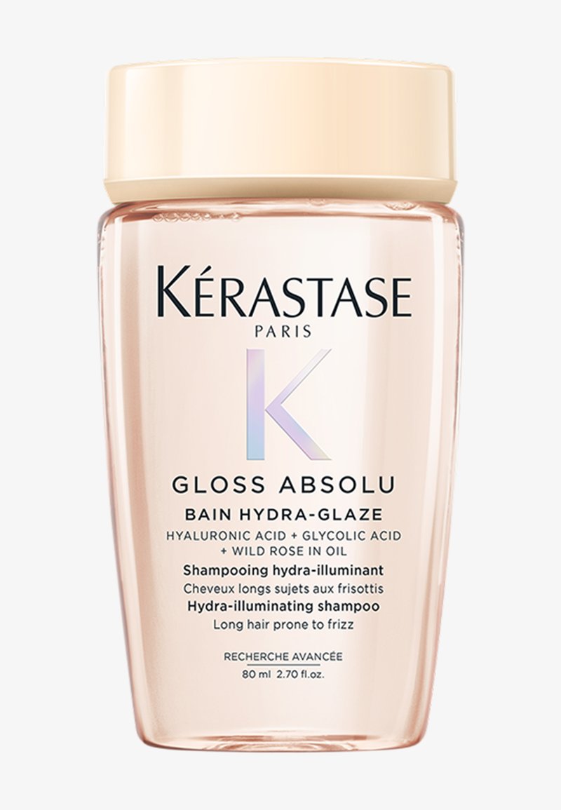 Kérastase Gloss Absolu shampoo in een heldere, ronde 80 ml fles met een perzikkleurige dop. Bevat de merknaam en productdetails in vetgedrukte tekst.