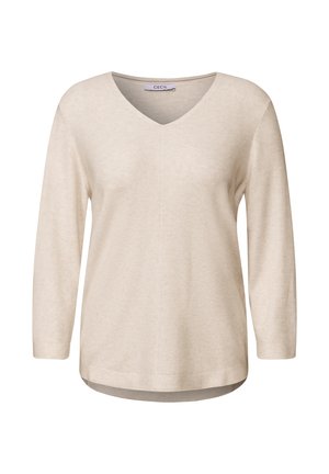 Maglietta beige a maniche lunghe con scollo a V, texture a coste e orlo curvo. Etichetta del marchio "CECIL" visibile sul collo. Materiale morbido e leggero.