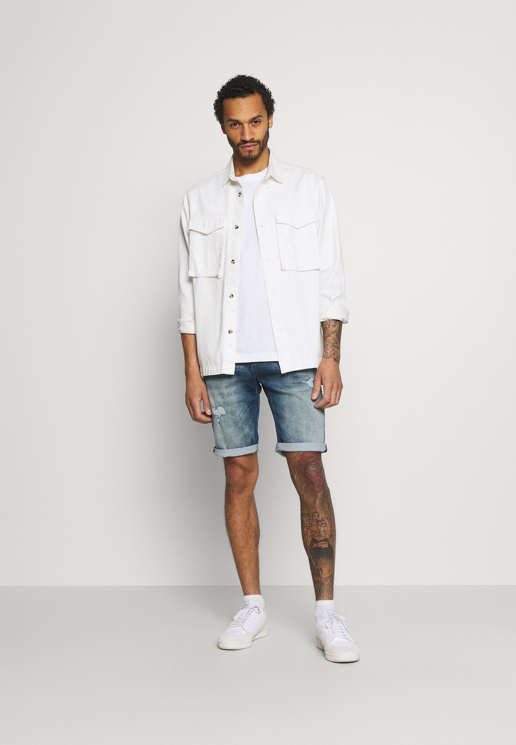 damaged denim shorts