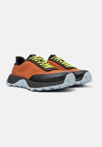 Sport sneakers with an orange mesh upper, black rubber accents, bright green laces, and a textured light blue outsole.