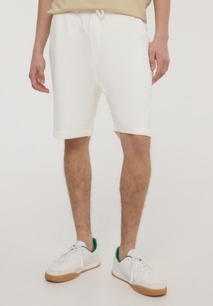 - Spodnie treningowe