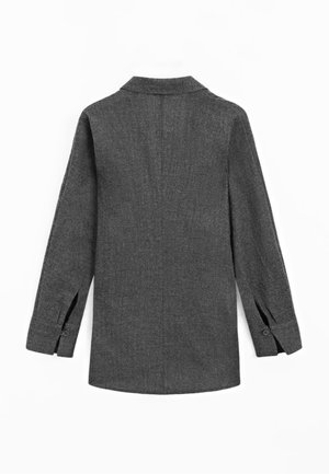 Grijze, lange mouwen shirt met een kraag, voorzien van een rechte snit en zijsplitten, gemaakt van een gestructureerde stof met knoopsluiting bij de manchetten.