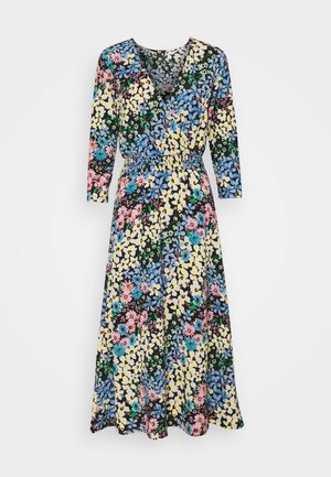 Vestido de estampado floral con mangas largas, escote en V y cintura elástica. Los colores incluyen amarillo, azul, rosa y verde sobre un fondo negro.