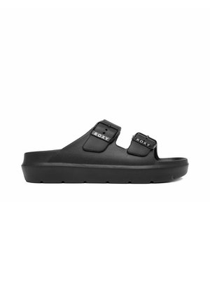 Sort slidesandal med to justerbare remme med spænder mærket "ROXY" og en tyk sål.