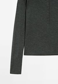 Dark gray long-sleeve top made of soft fabric, featuring a henley neckline with a row of black buttons down the front and simple seam detailing.
