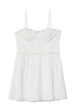 Robes en coton blanc avec des bretelles spaghetti, décolleté à volants, fermeture à boutons et tissu texturé. Longueur genoux avec une silhouette évasée.