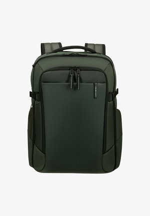 Zaino Samsonite verde scuro con spallacci imbottiti, tasca frontale con zip e maniglia superiore, progettato per viaggiare e per l'uso quotidiano.