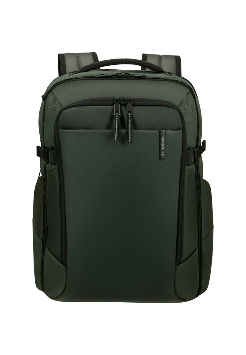 Mörkgrön Samsonite-ryggsäck med vadderade axelremmar, framficka med dragkedja och handtag på toppen, designad för resor och daglig användning.