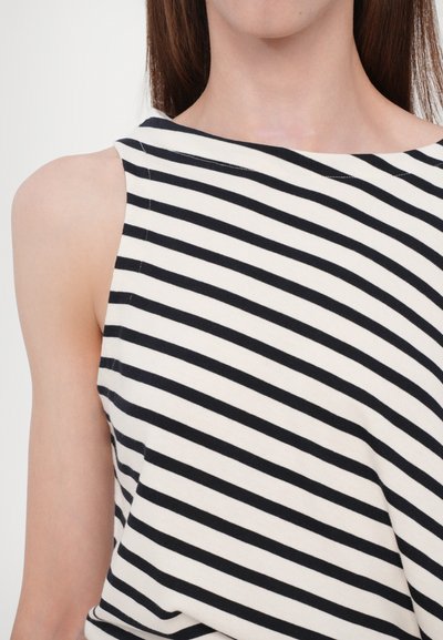 Striped sleeveless top made from soft, lightweight fabric; features black and cream horizontal stripes and a wide neckline.