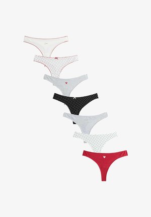 Seven women's cotton thong underwear in various colors and patterns, including hearts and small bows, arranged vertically on white background.