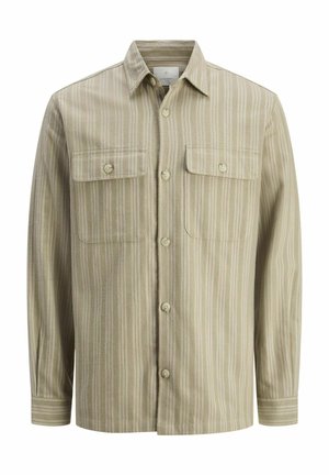 Beige gombos ing függőleges világos és sötét csíkokkal, két mellzsebbel és klasszikus gallérral, textúrált anyagból készült.