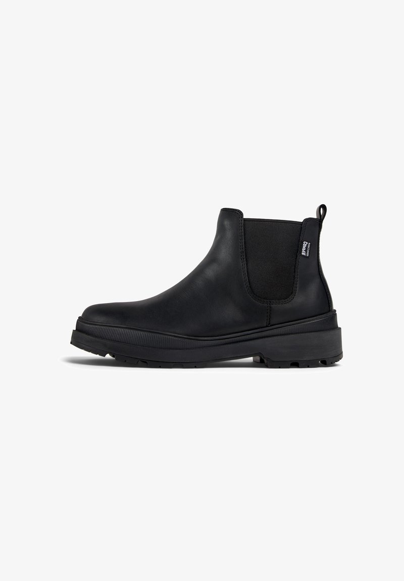 Schwarze Leder-Chelsea-Boots mit elastischen Seitenpaneelen, runder Zehenpartie und strukturiertem Gummisohle. Ausgestattet mit einem Ziehhilfe für einfaches An- und Ausziehen.