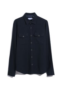 Marineblauwe lange mouw blouse met knopen, gemaakt van katoen, met twee zakken aan de voorkant, een afgeronde zoom en donkere knopen, met een label bij de kraag.