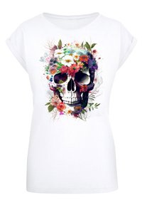 White t-shirt featuring a colorful floral skull design with vibrant flowers and greenery, textured graphic print on a soft fabric.