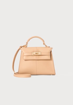 Beige leather handbag with a structured shape, top handle, adjustable strap, and gold hardware clasp detail. Smooth texture, minimalist design.